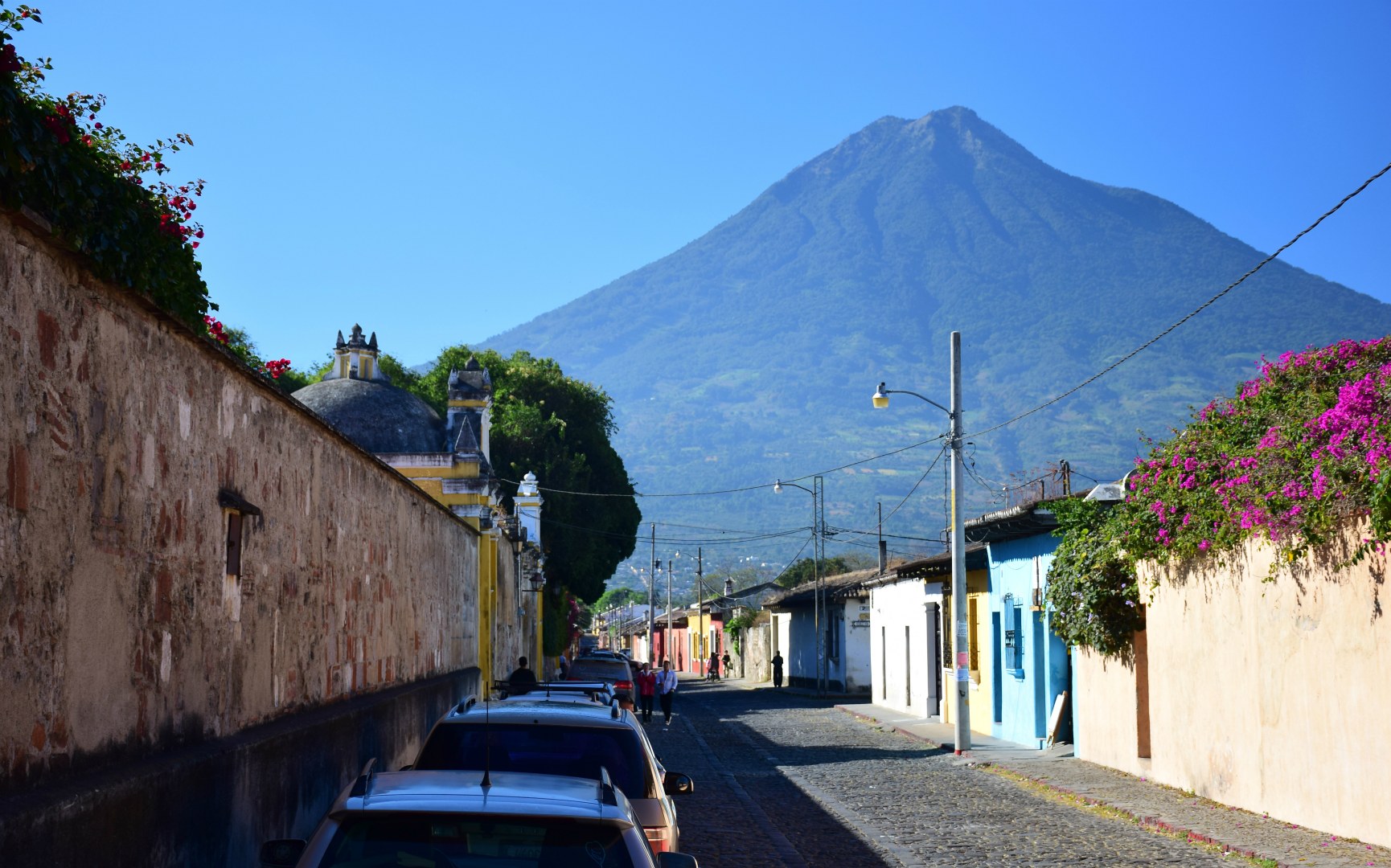 Typical street and Volcan Agua, Antigua, Guatemala